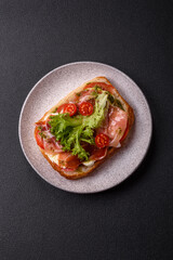 Ciabata with jamon or prosciutto, tomatoes, cheese and lettuce