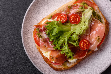 Ciabata with jamon or prosciutto, tomatoes, cheese and lettuce
