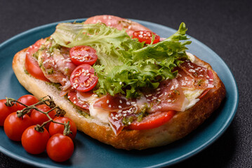 Ciabata with jamon or prosciutto, tomatoes, cheese and lettuce