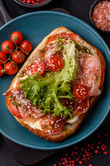 Ciabata with jamon or prosciutto, tomatoes, cheese and lettuce
