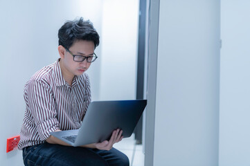 Computer engineer is setting up network in server room,Systems Maintenance Technician,Male engineer working in server room at modern data center