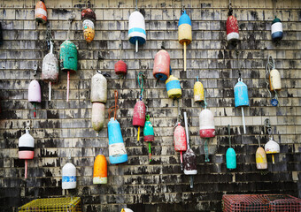 Lobster fishing buoys and traps on the dock in downtown Portland Maine © zimmytws