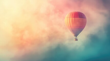 Obraz premium A vibrant hot air balloon drifting through colorful clouds, creating a dreamy and serene atmosphere in the sky.