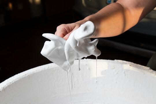 The hands of a craftswoman elaborating a traditional and ancestral figure of clay craftsmanship in Mallorca (Spain) called "siurell".