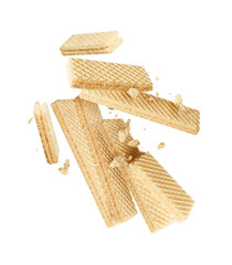 Group of crispy waffles crushed in the air close-up isolated on white background