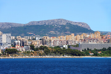 Contemporary buildings, gardens and beaches at the waterfront in Split, Croatia. View of Split from the boat.