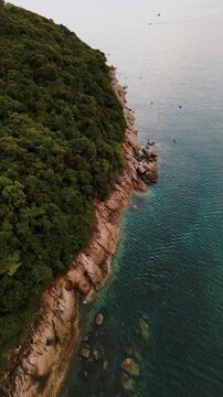 Vertical Video - Aerial view of the coast of an Island