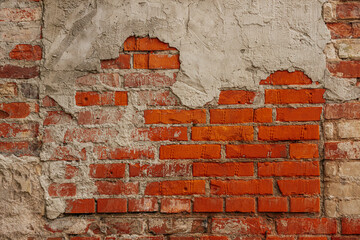 A close-up of a red brick wall partially covered with worn and peeling plaster. The texture reveals a mix of rough brick and deteriorating cement, showcasing age and decay.