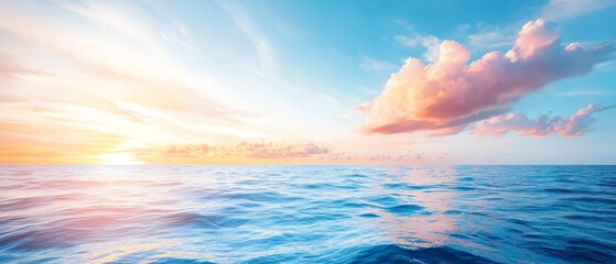 Obraz premium A vast expanse of water, topped by the sky and its scattered clouds, with the sun situated centrally over the ocean