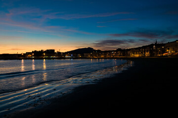 Image of Panxon beach and its promenade at dusk with a beautiful blue sky with clouds. Nigran - Galicia - Spain © Chris DoAl