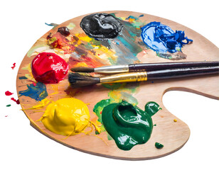 Wooden art palette with blobs of paint and a brushes Splash on a white isolated background....