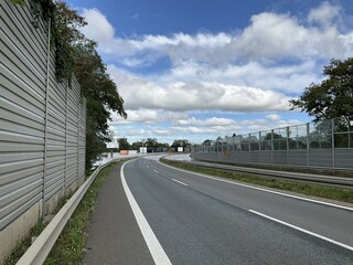 Fototapeta premium Flooded and impassable national road DK1 due to pool of water at confluence of Rivers Wapienica and Iłownica during flood in September 2024 in Poland in Czechowice Dziedzice. Topic: river alert status
