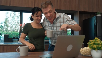 Lovely old marriage couple contact friend or relative through internet network with laptop . Seniors have happy relationship and family. Globalization technology connect far away person. Divergence.