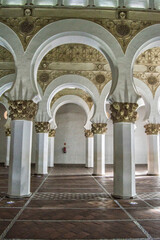 Fototapeta premium Interior with Mudejar arches of Santa Maria la Blanca in Toledo. Spain