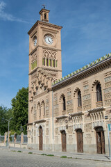 Clock tower and neo-Mudejar brick exterior facade of the Toledo train station. Spain