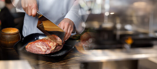 Cooking meat in a professional restaurant kitchen.