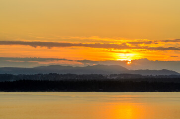 ocean sunset over mountains at summer day in Vancouver, Canada