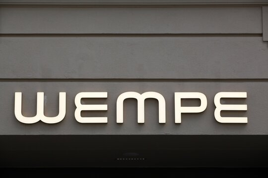 Berlin, Germany - July 13, 2020: Wempe logo on a wall. Founded in 1878 in Elsfleth, Lower Saxony, and based in Hamburg since 1907,  Wempe is a German jeweler