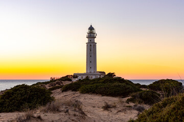 Sunset Serenity at Cape Trafalgar: Lighthouse, Sand, and Sea