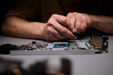 Hand Repairing a Graphics Card through the Application of Thermal Paste for Better Performance