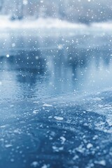 Snowflakes Gently Falling on Reflective Frozen Pond in Serene Winter Landscape