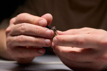 Hands Firmly Holding USB and Connector Cables for the Purpose of Electronics Repair Work