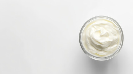 "Top view of sour cream or yogurt in a glass bowl, isolated on a white background, showcasing full depth of field."

