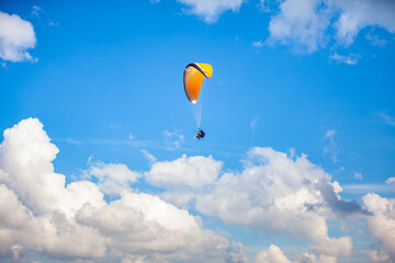 People paragliding over the beautiful mountains of the Antioquia department in Colombia. Tandem Paragliding. Extreme sport concept.