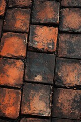 Rustic brick wall with weathered tiles showcasing earthy tones and textures indoors