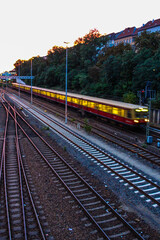 View of a colorful sunset from the bridge with S-bahn train, Neukölln Berlin
