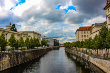 Naklejka premium Berlin-Spandau Shipping Canal Sandkrug Bridge between buildings and trees