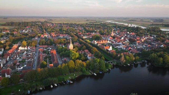 Aerial footage of Friedrichstadt, Dutch town in the state Schleswig-Holstein with the romantic canals situated on the river Eider and Treene, Nord frisia, Germany. Fligth over Westersielzug.