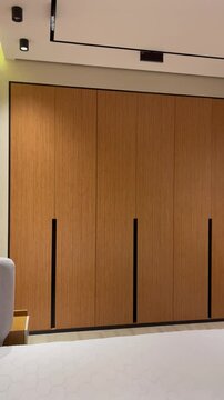 Video of Modern Bedroom Interior with Wooden Wardrobe and Minimalist Design