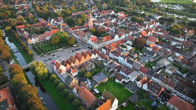 View of the Marktplatz and Remonstrants Church in Friedrichstadt, charming Dutch-style town in Schleswig-Holstein with romantic canals along the Eider and Treene rivers and framed by gabled houses.