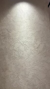 Close-Up of Venetian Plaster Wall Texture and Ceiling Lighting in Modern Interior