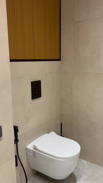 Video of Wall-Mounted Toilet in Minimalist Bathroom - Upward View