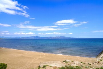 view from the beach over the Golf de Roses and the Mediterranean Sea towards Roses and the Pyrenees at the horizon, l'Escala, Costa Brava, Girona, Figueres, Spain
