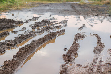 The dirt road was flooded in the afternoon