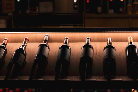 Bordeaux wine bottles on illuminated display