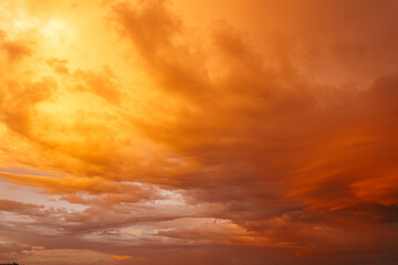 Beautiful colorful bright sunset sky with orange clouds. Nature sky background.
