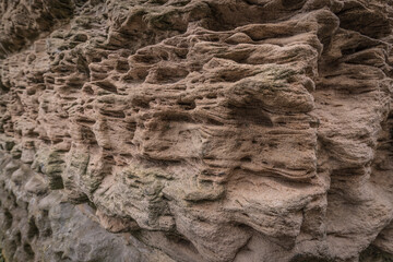 Detail of a weathered sandstone wall.