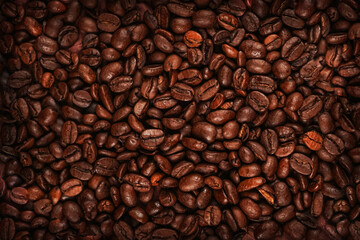 Roasted coffee beans close up photo. Coffee beans top view macro. Roasted beans for sale good quality.