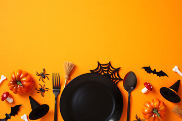 Halloween table setting with pumpkins, fly agarics, witch hats, bats, spiders, and spooky...