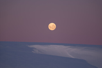 Full yellow moon in Antarctica. Night