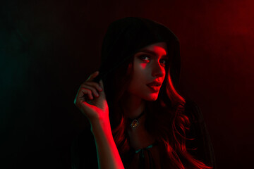 Photo of dangerous evil warlock woman touch cape look feel teasing isolated dark red neon mist color background