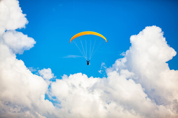 People paragliding over the beautiful mountains of the Antioquia department in Colombia. Tandem Paragliding. Extreme sport concept.