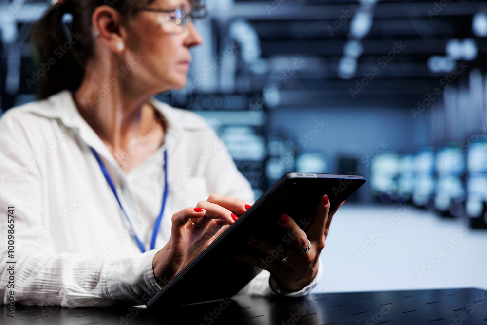 Poster trained serviceman using tablet to assess server security blips arising due to unsecured network con