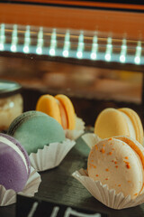French desert stacked by color and flavors, popular sweet meringue-based cookie with a light airy...
