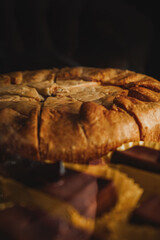 Chicken pie front view close up. Display case with a variety of cakes and cupcakes. Deserts at cafes and coffeeshops.
