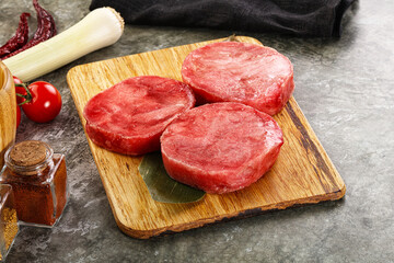 Delicous raw tuna medallion for cooking